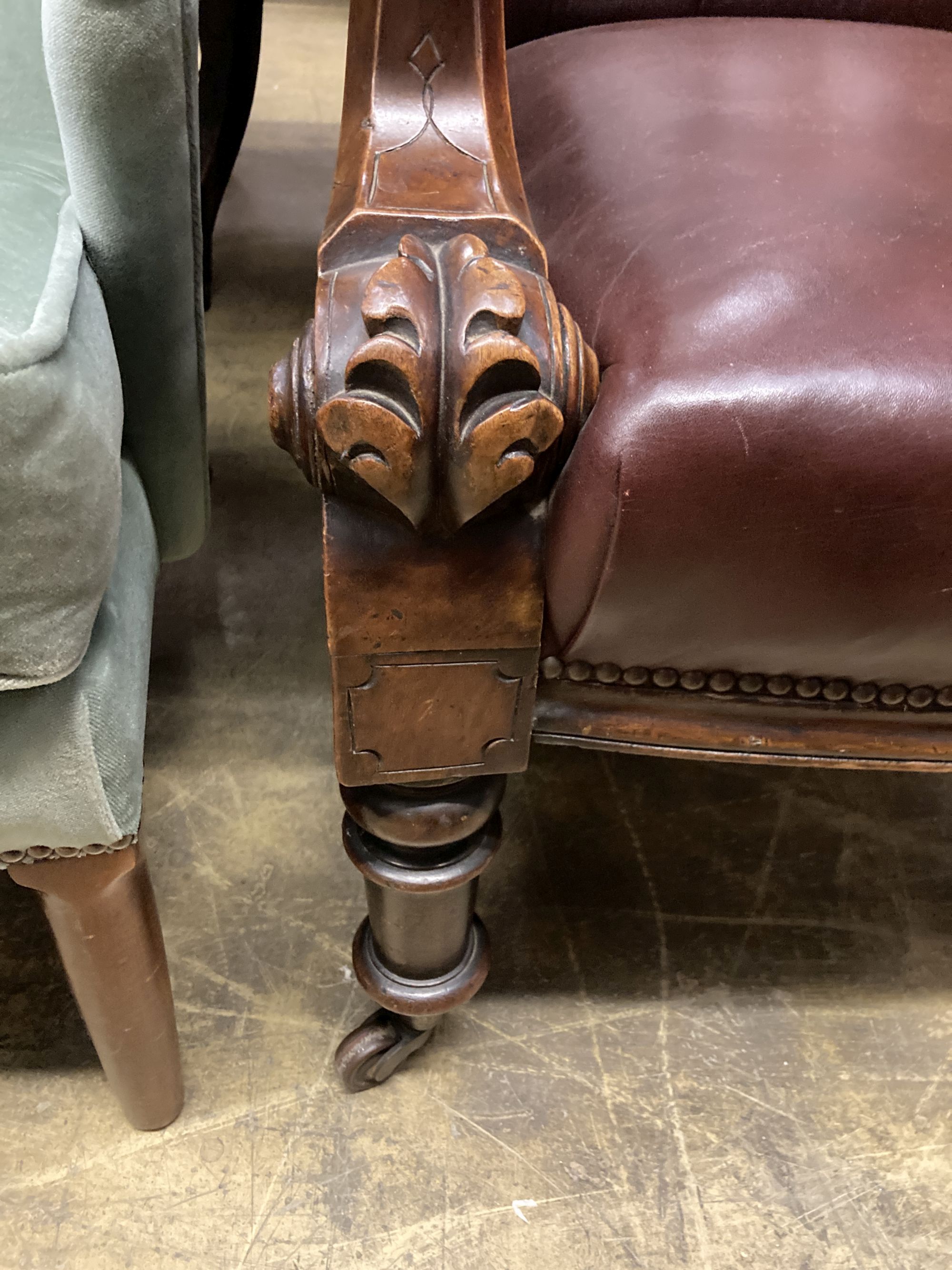 An early Victorian burgundy leather library chair, width 68cm, depth 80cm, height 98cm